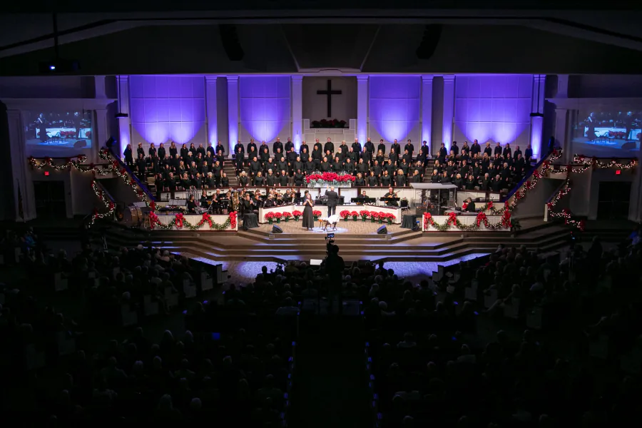 Florence Baptist Temple choir and musicians performing in the decorated sanctuary at Christmas