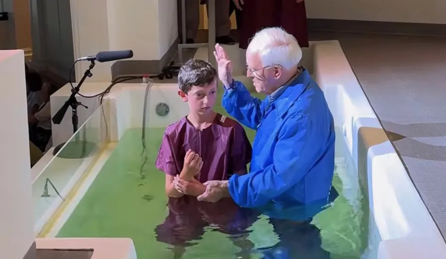 Pastor Bill Monroe standing with a young person in the Florence Baptist Temple baptistry