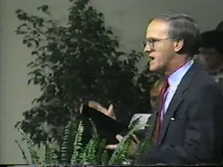 Pastor Bill Monroe gesturing while preaching during a 1987 Florence Baptist Temple service