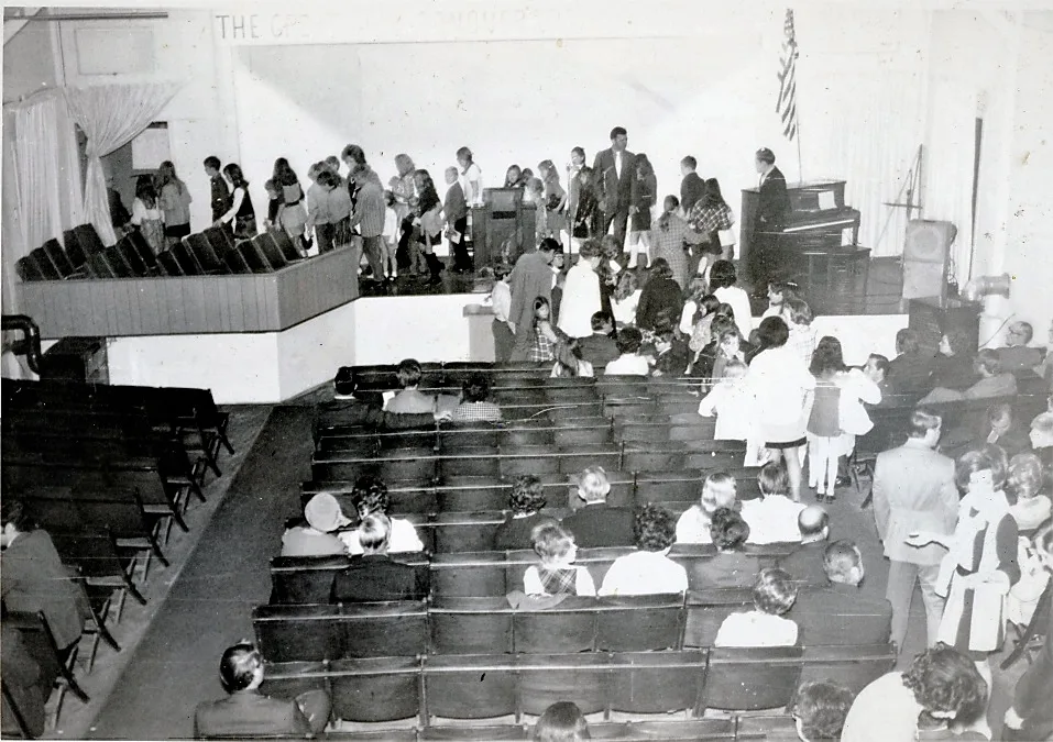 Congregation seated during a service in an early Florence Baptist Temple auditorium